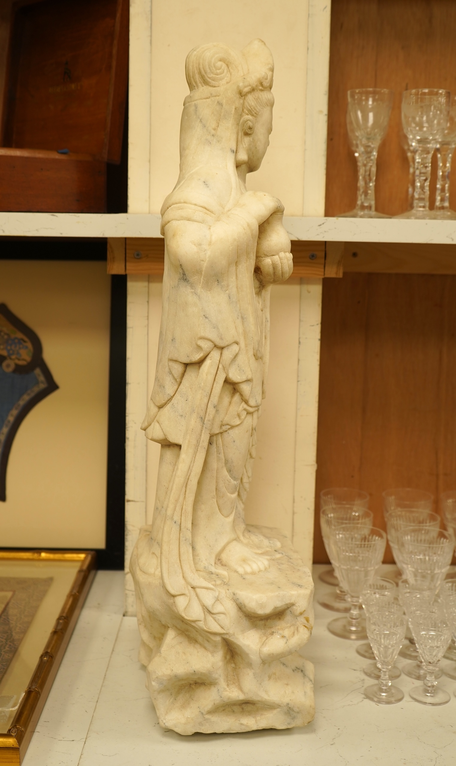 A large Chinese alabaster carving of Guanyin, 66cm high